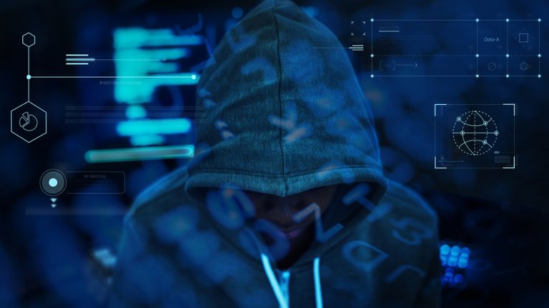 Man looking down wearing a jacket with the hood covering his head blended into a blue background that displays various charts of information