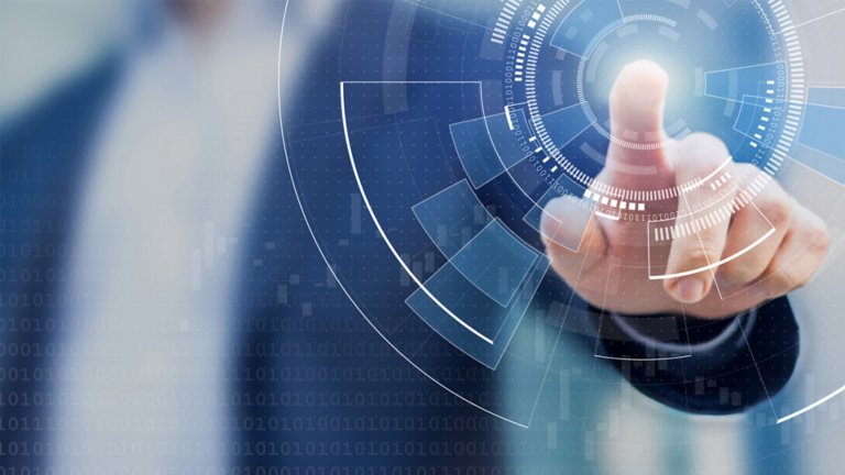 Man wearing a suit jacket touching a virtual circular image in front of him