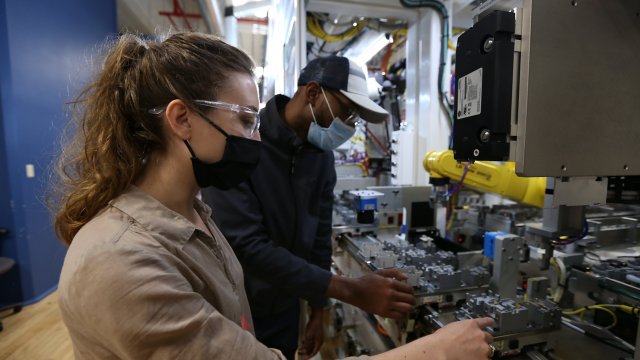 employees working on rockwell automation contactor line