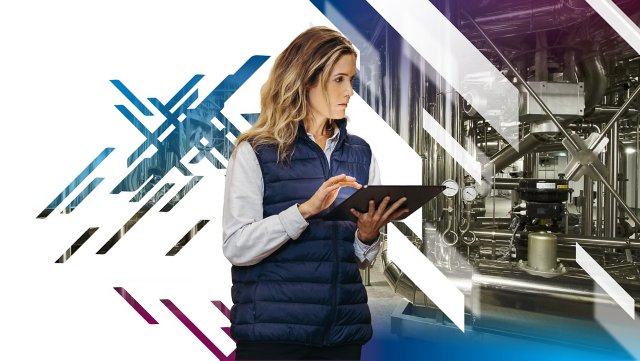 Woman in blue vest with ipad checking inventory
